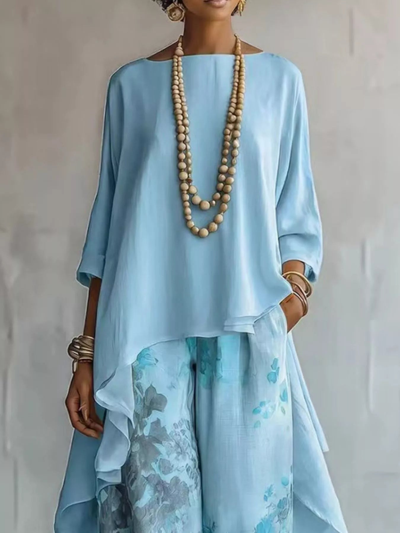 Asymmetrical Hem Top and Floral Pants Set designed for comfort and style at Lookzlike