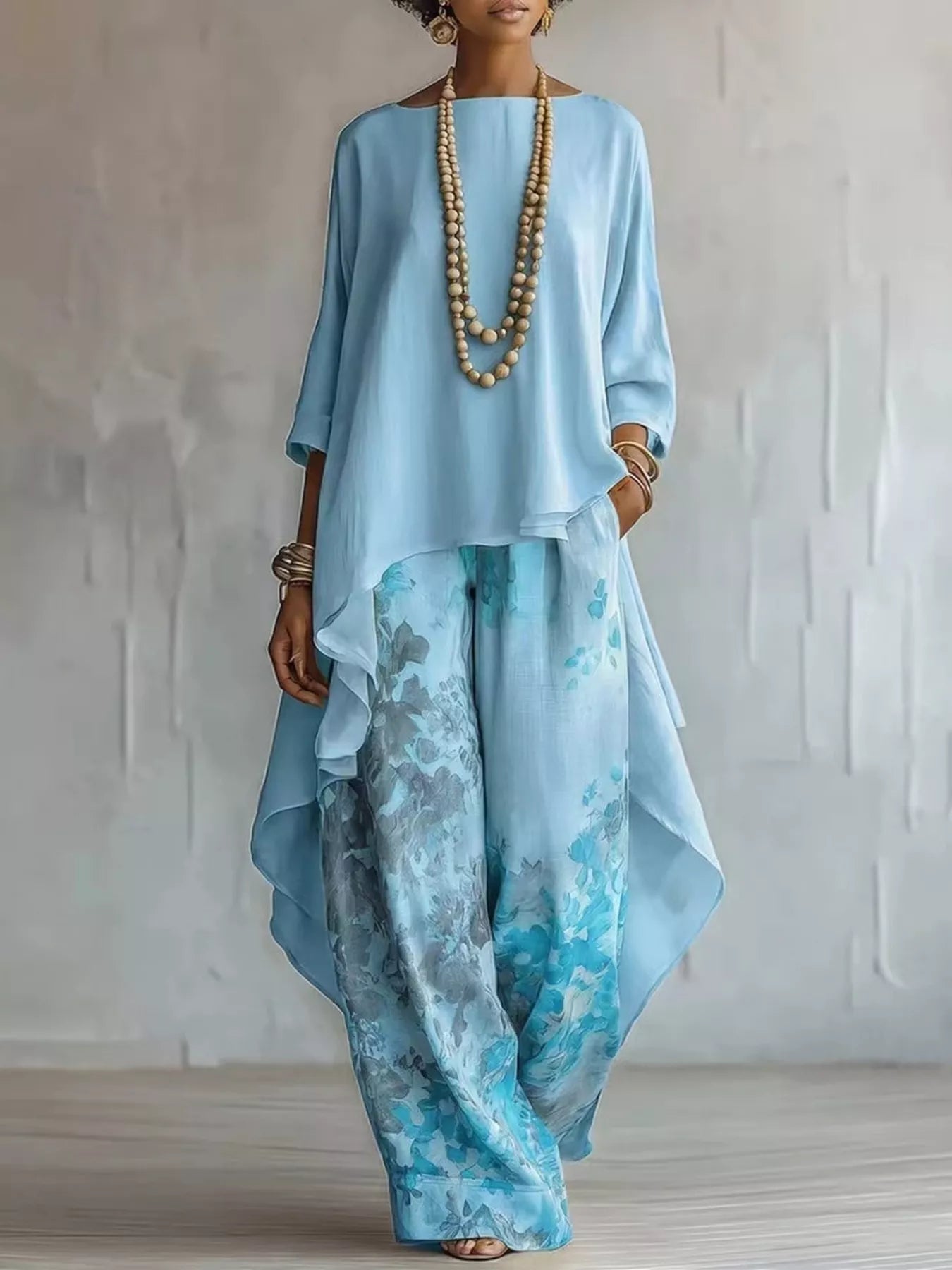 Asymmetrical Hem Top and Floral Pants Set designed for comfort and style at Lookzlike