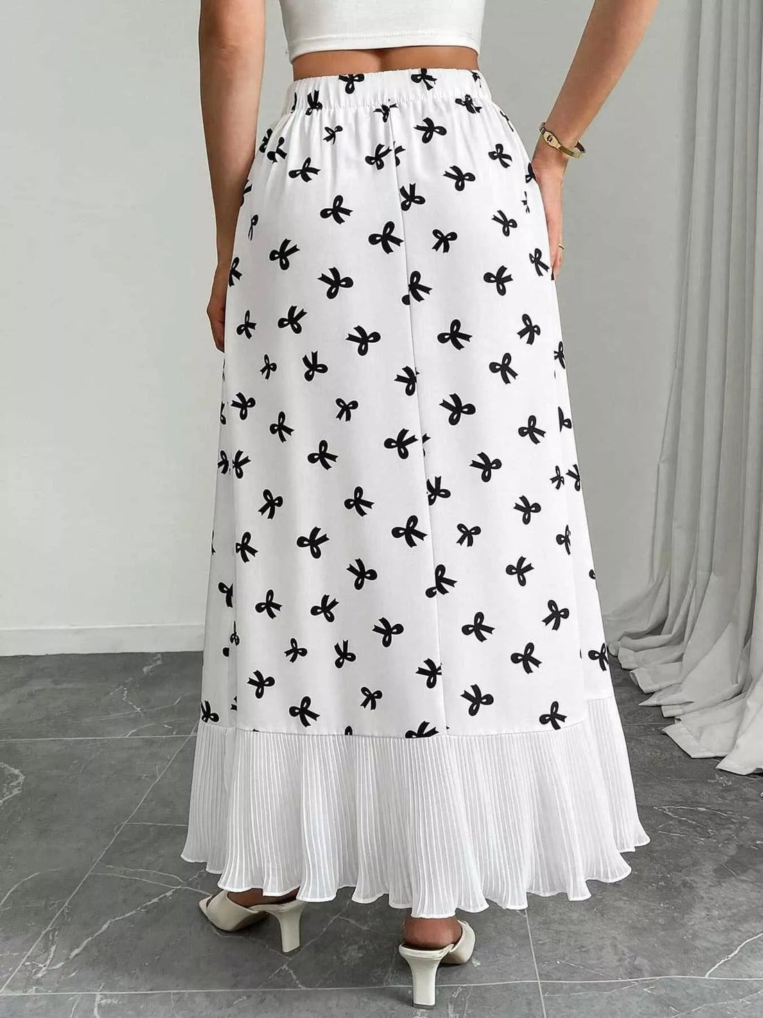 Bow Print Ruffle Hem Flowy Maxi Skirt designed for comfort and style at Lookzlike