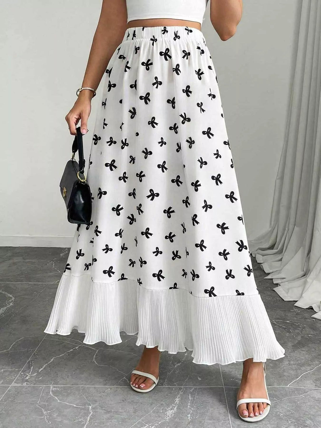 Bow Print Ruffle Hem Flowy Maxi Skirt designed for comfort and style at Lookzlike
