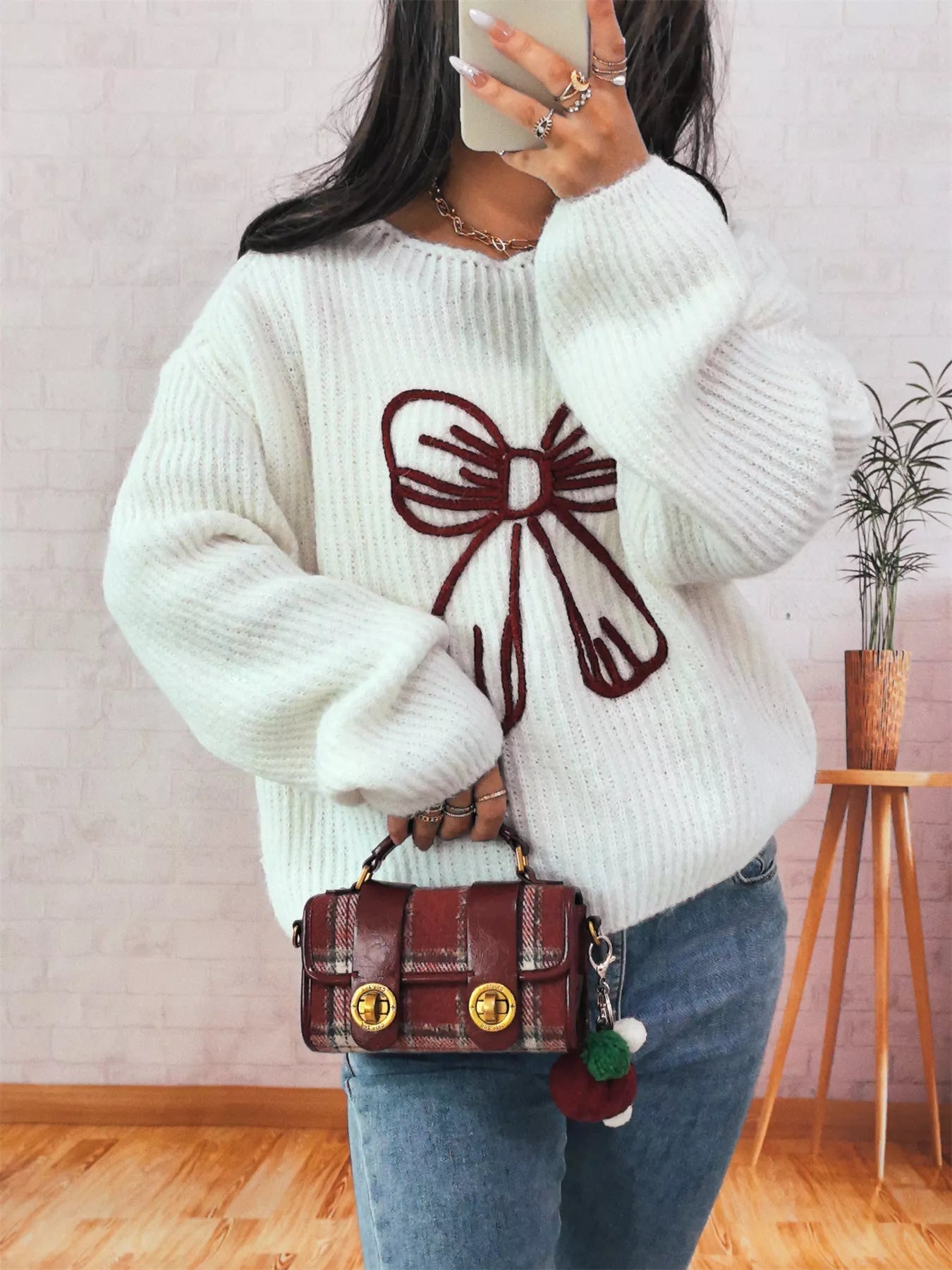 Bow Round Neck Long Sleeve Sweater designed for comfort and style at Lookzlike