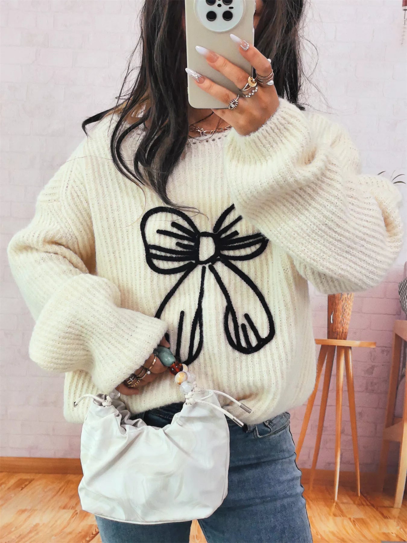 Bow Round Neck Long Sleeve Sweater designed for comfort and style at Lookzlike