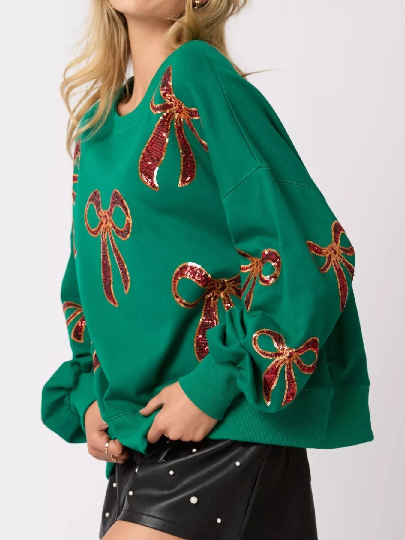 Christmas Sequin Bow Round Neck Sweatshirt designed for comfort and style at Lookzlike