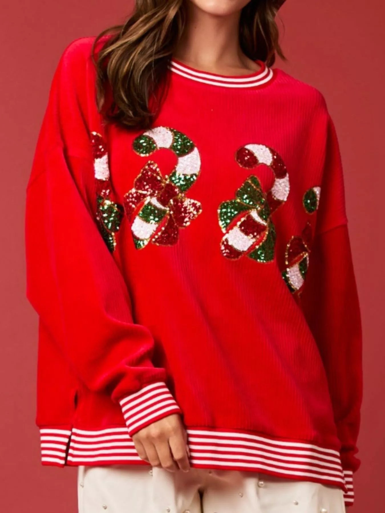 Christmas Sequin Candy Cane and Santa Sweatshirt with Striped Hem designed for comfort and style at Lookzlike