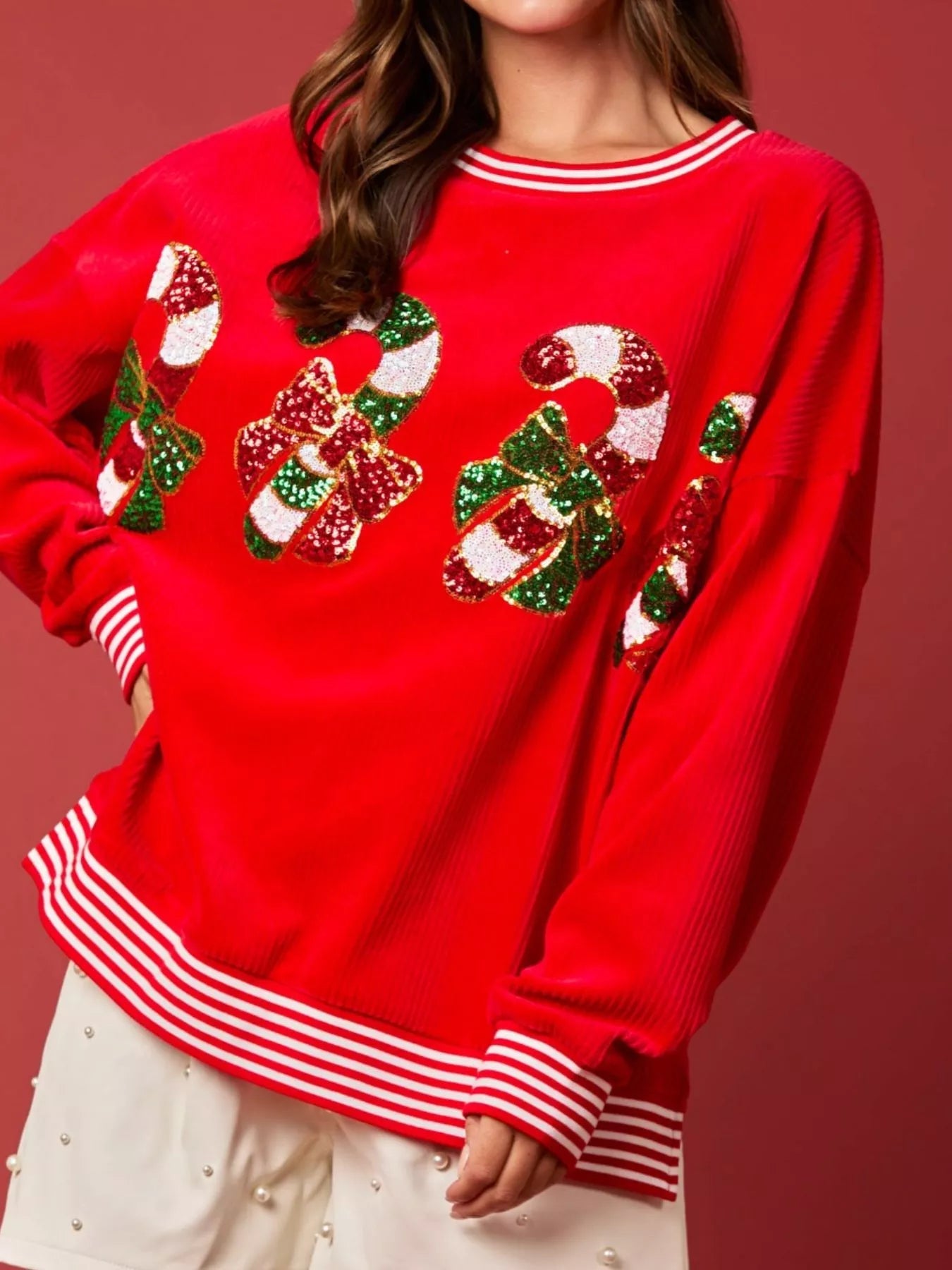 Christmas Sequin Candy Cane and Santa Sweatshirt with Striped Hem designed for comfort and style at Lookzlike