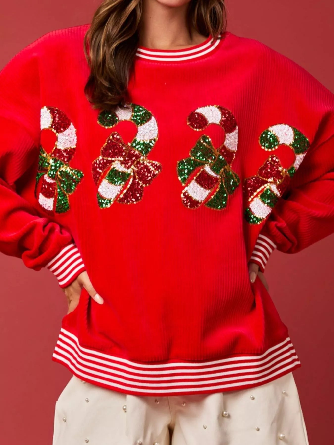 Christmas Sequin Candy Cane and Santa Sweatshirt with Striped Hem designed for comfort and style at Lookzlike