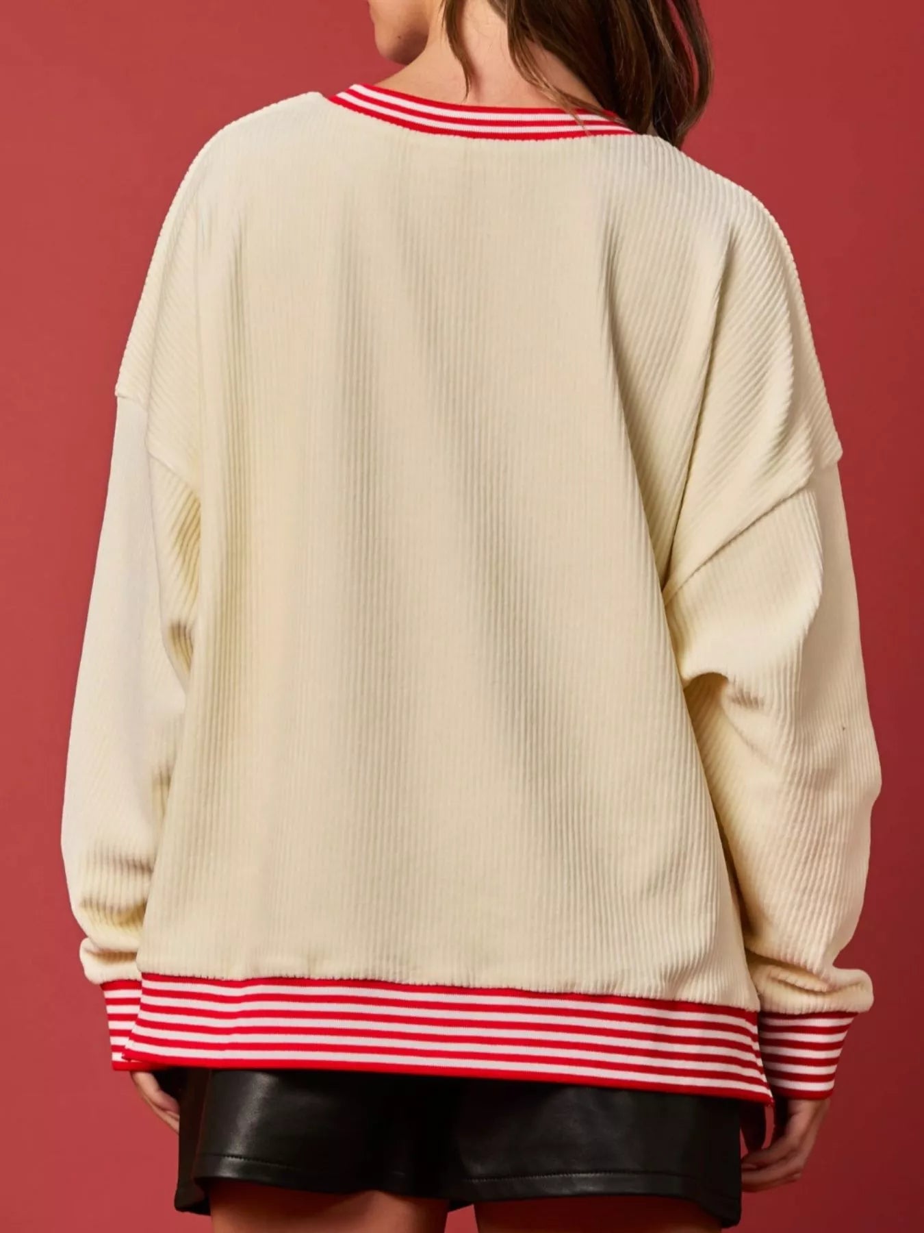 Christmas Sequin Candy Cane and Santa Sweatshirt with Striped Hem designed for comfort and style at Lookzlike