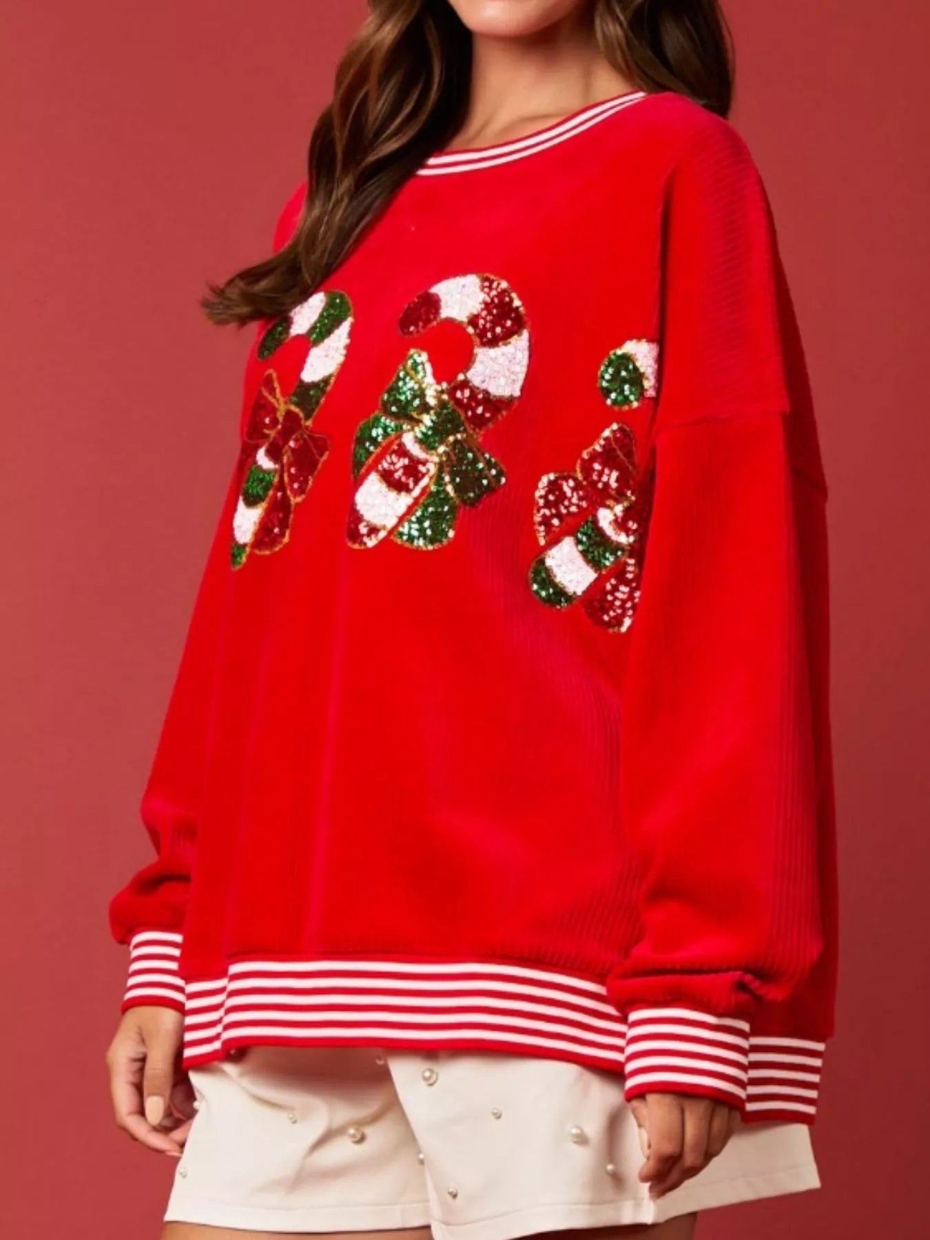 Christmas Sequin Candy Cane and Santa Sweatshirt with Striped Hem designed for comfort and style at Lookzlike
