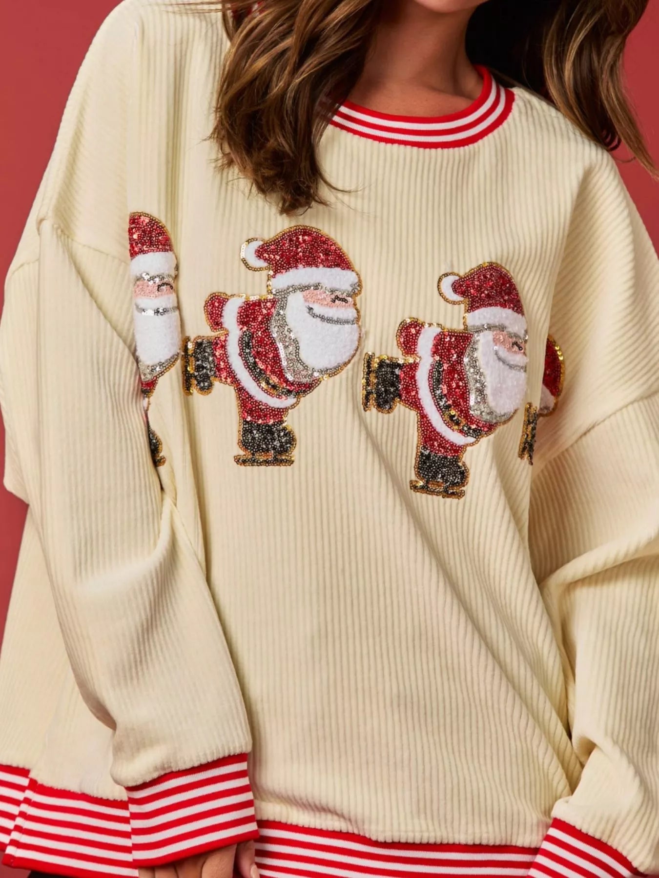 Christmas Sequin Candy Cane and Santa Sweatshirt with Striped Hem designed for comfort and style at Lookzlike