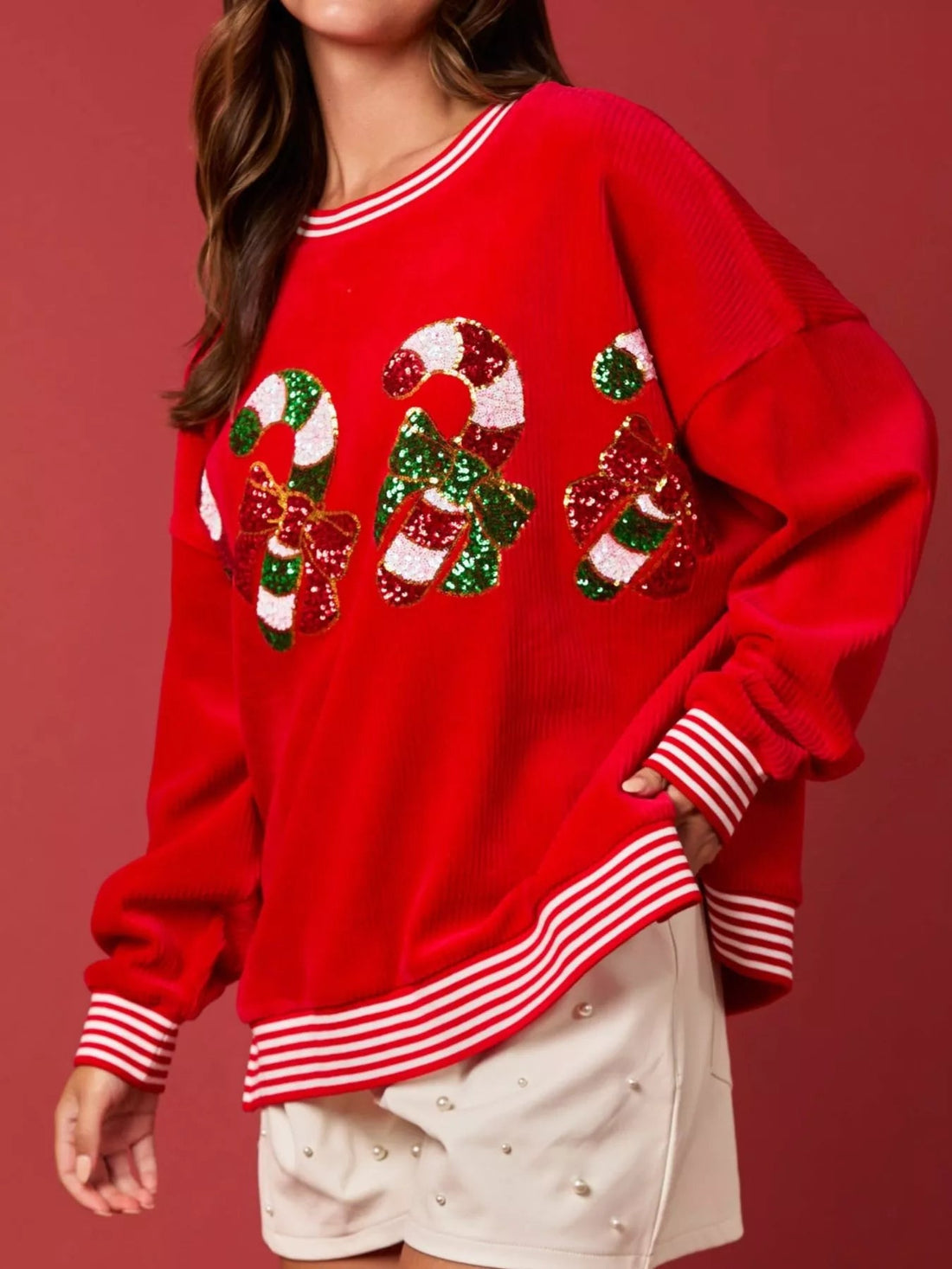 Christmas Sequin Candy Cane and Santa Sweatshirt with Striped Hem designed for comfort and style at Lookzlike