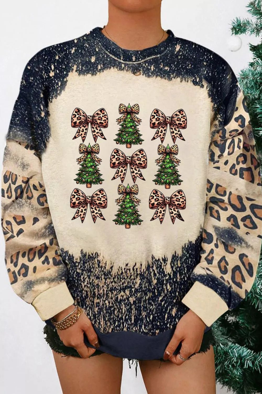 Christmas Tree & Leopard Bow Round Neck Sweatshirt designed for comfort and style at Lookzlike