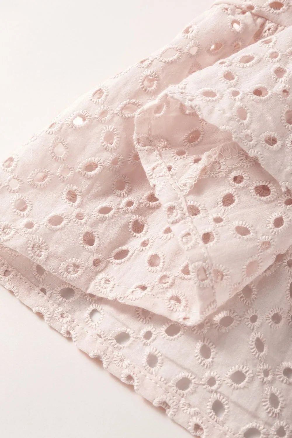 Embroidered Eyelets Ruffled Hem Sleeveless Mini Dress designed for comfort and style at Lookzlike
