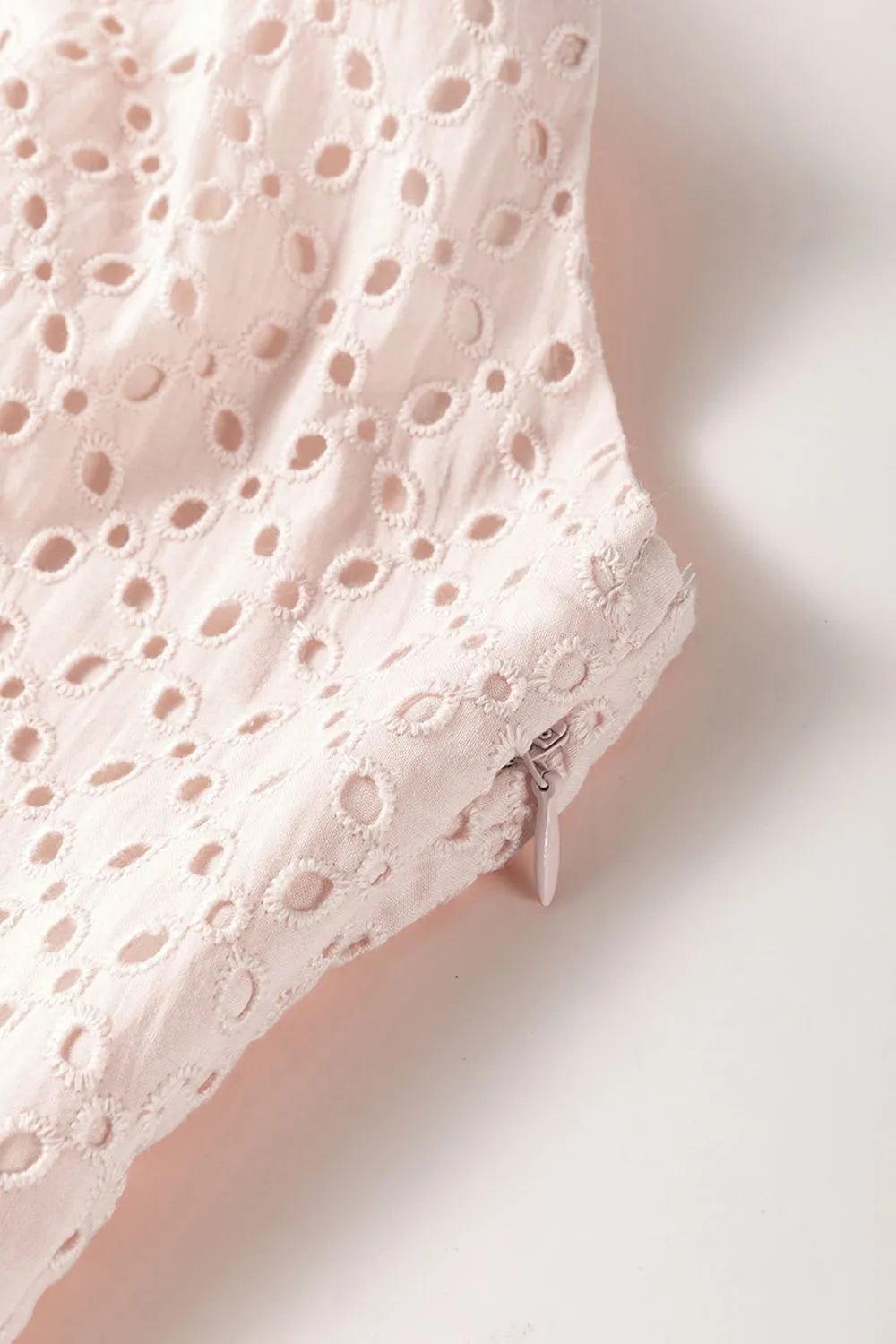 Embroidered Eyelets Ruffled Hem Sleeveless Mini Dress designed for comfort and style at Lookzlike