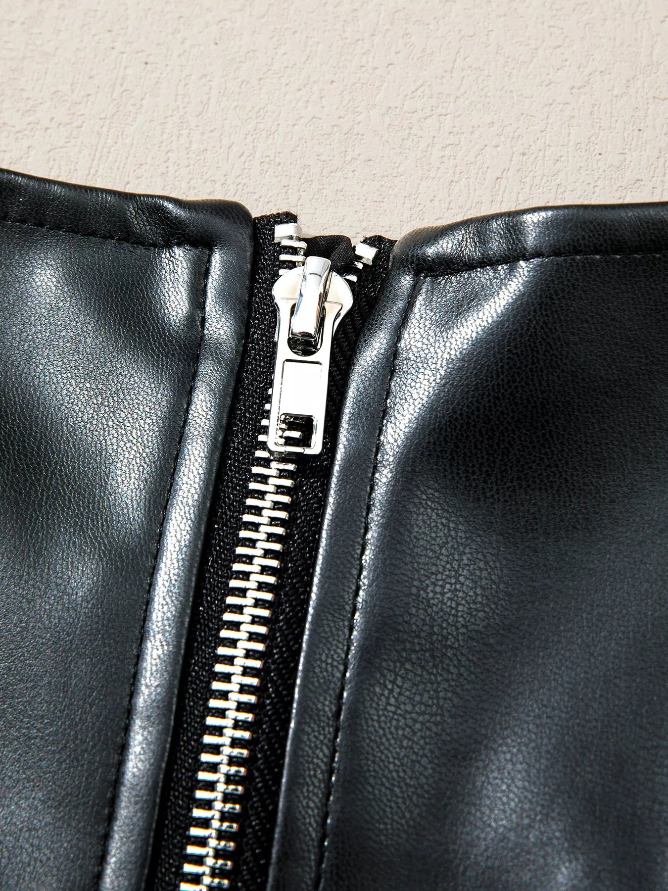 Faux Leather Ruffle Hem Sleeveless Mini Dress designed for comfort and style at Lookzlike