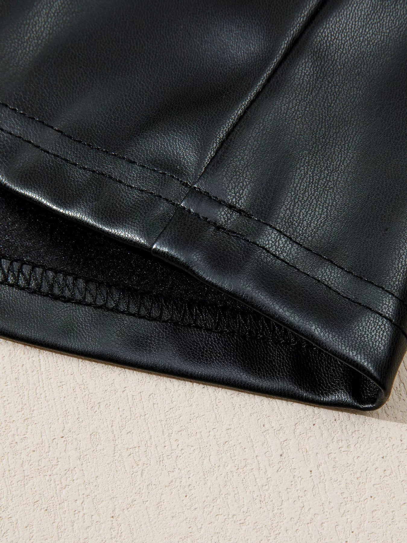 Faux Leather Ruffle Hem Sleeveless Mini Dress designed for comfort and style at Lookzlike