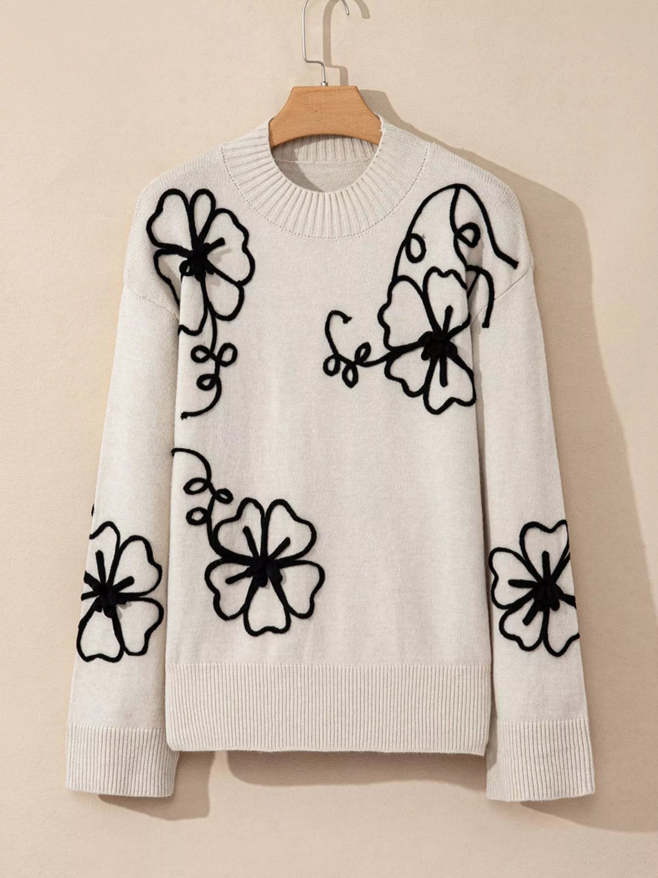 Flower Stitching Mock Neck Sweater designed for comfort and style at Lookzlike