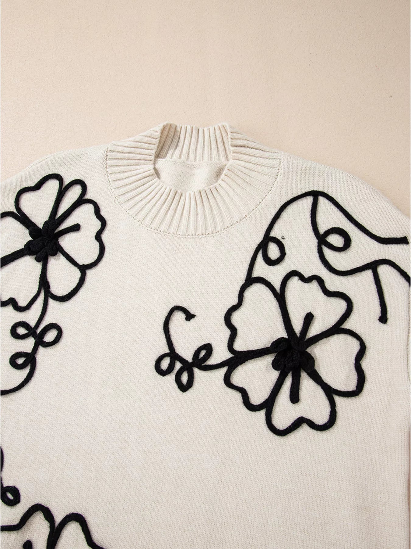 Flower Stitching Mock Neck Sweater designed for comfort and style at Lookzlike