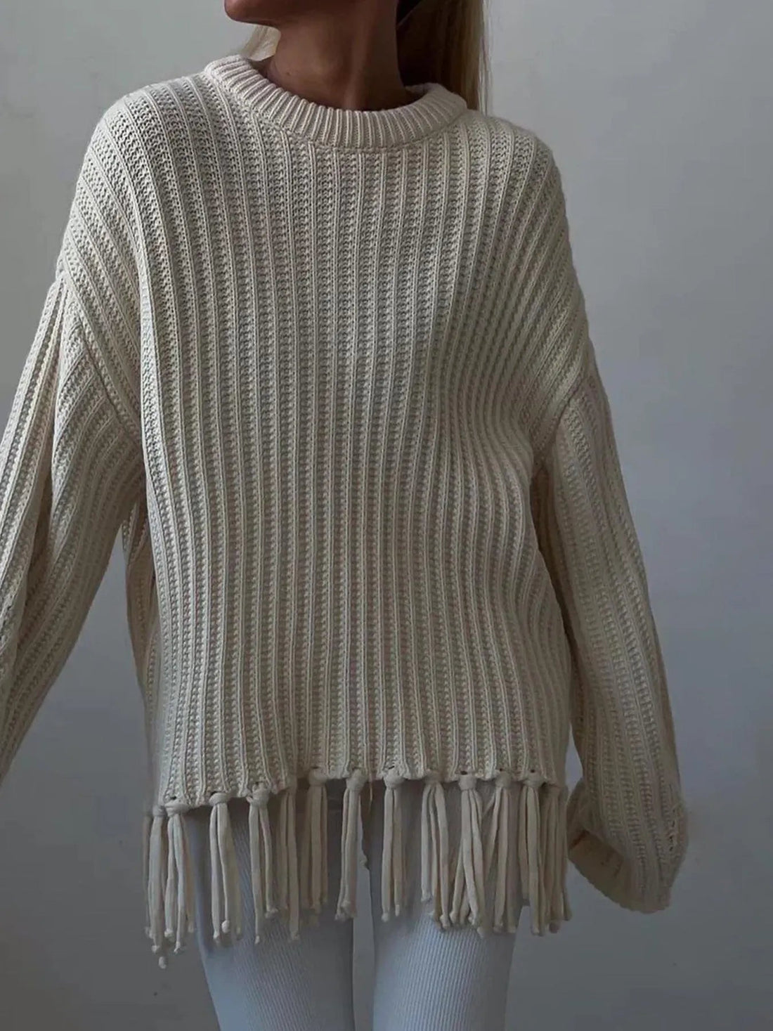 Fringe Round Neck Long Sleeve Sweater designed for comfort and style at Lookzlike