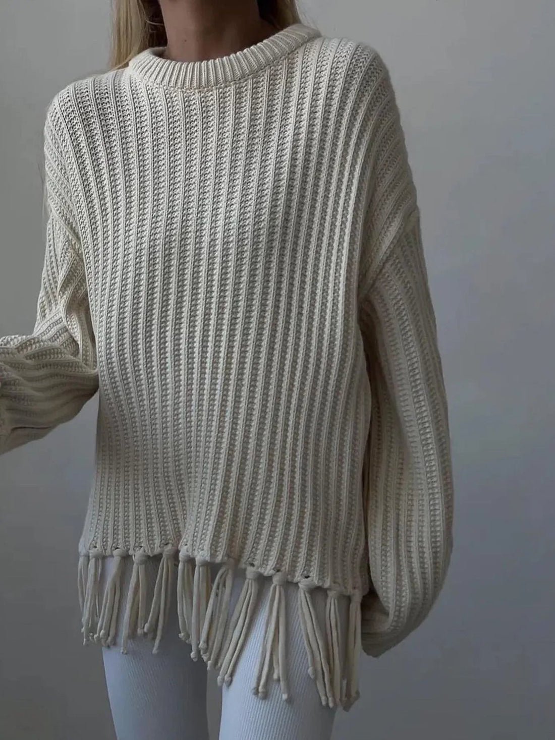 Fringe Round Neck Long Sleeve Sweater designed for comfort and style at Lookzlike