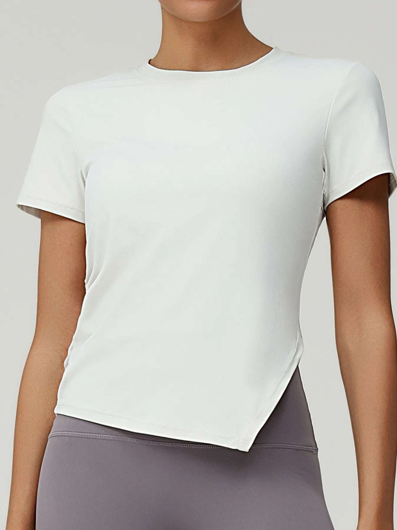 Full Size Slit Round Neck Short Sleeve Active T-Shirt Plus Size designed for comfort and style at Lookzlike