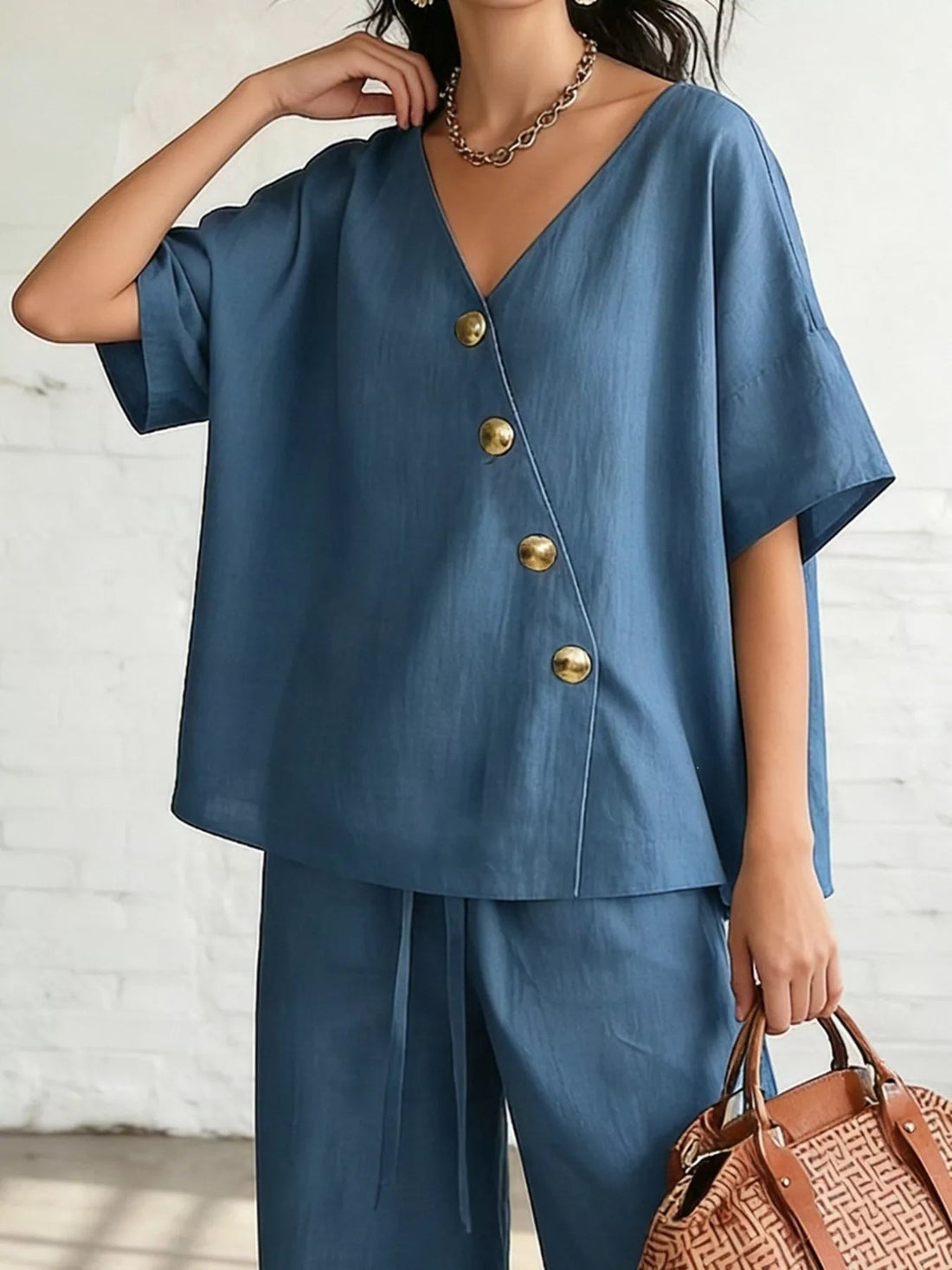 Full Size Surplice Half Sleeve Top and Wide-Leg Pants Set Plus Size designed for comfort and style at Lookzlike
