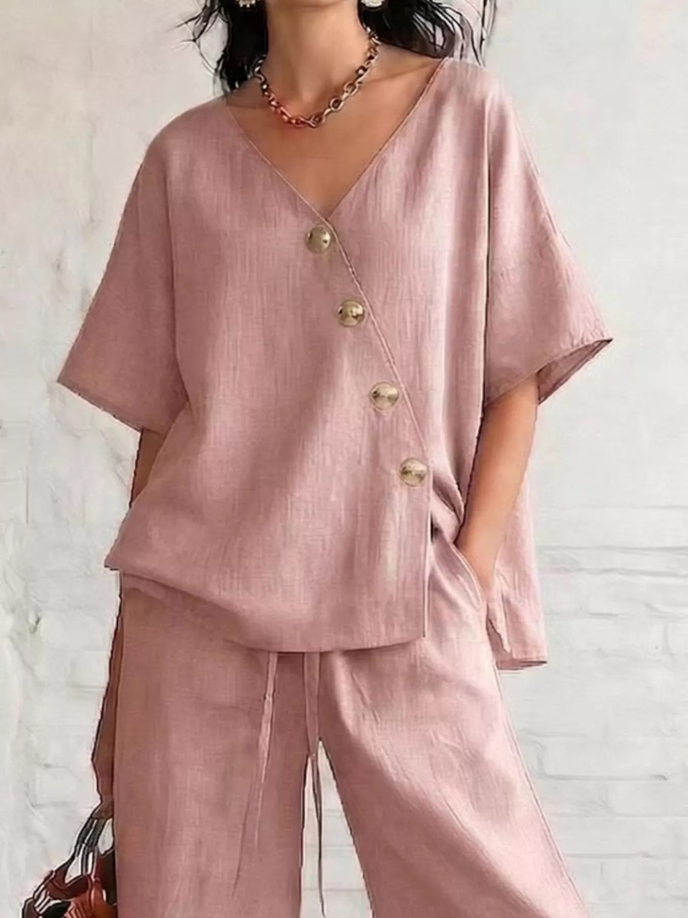 Full Size Surplice Half Sleeve Top and Wide-Leg Pants Set Plus Size designed for comfort and style at Lookzlike