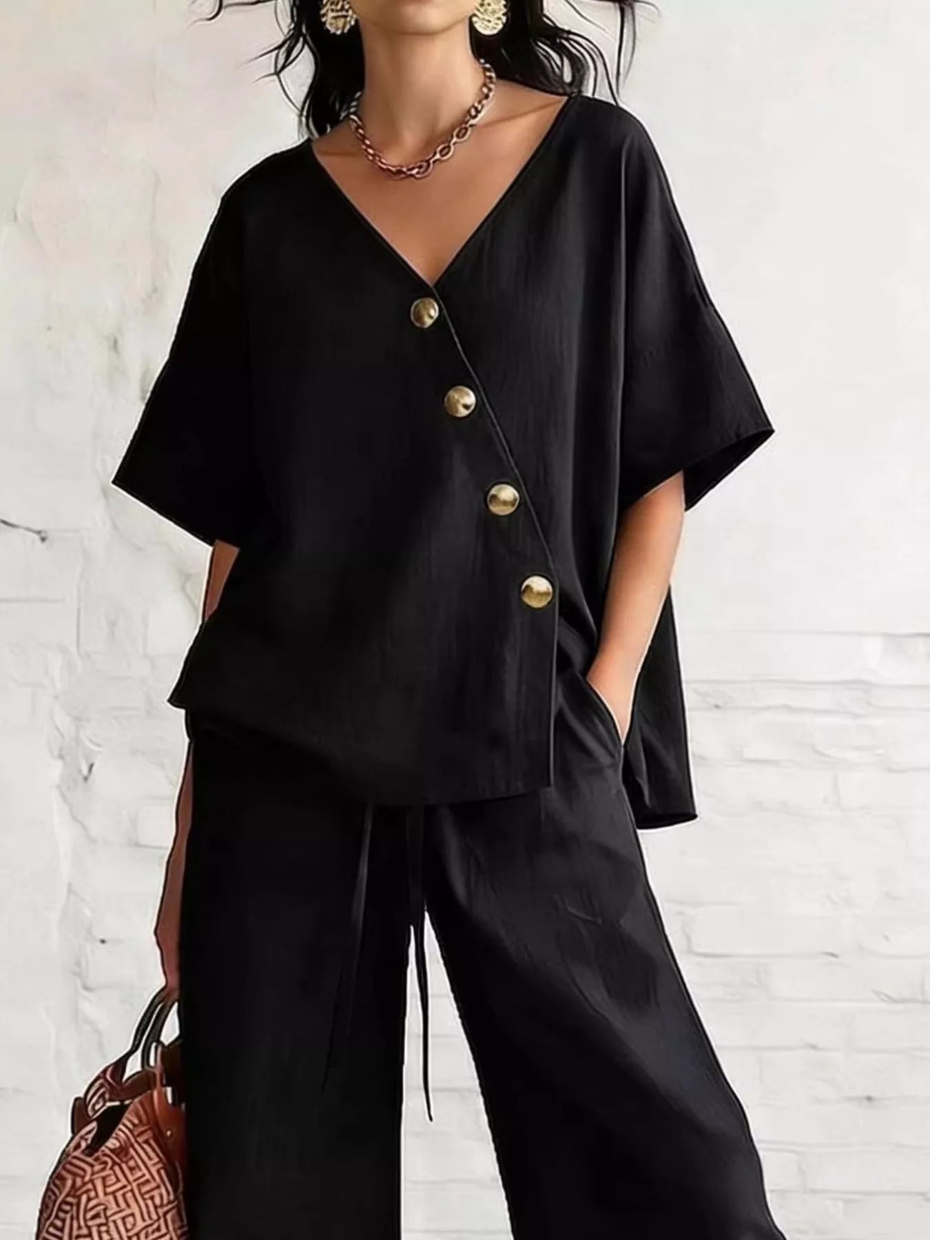 Full Size Surplice Half Sleeve Top and Wide-Leg Pants Set Plus Size designed for comfort and style at Lookzlike