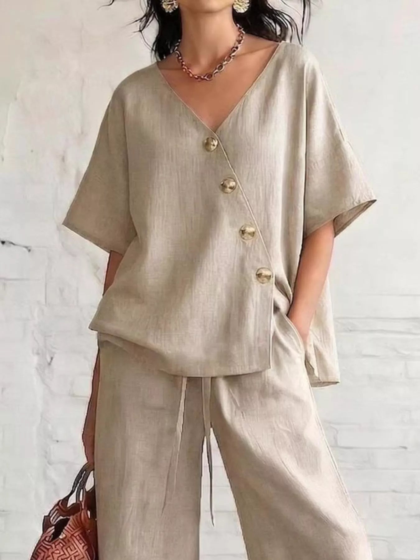Full Size Surplice Half Sleeve Top and Wide-Leg Pants Set Plus Size designed for comfort and style at Lookzlike