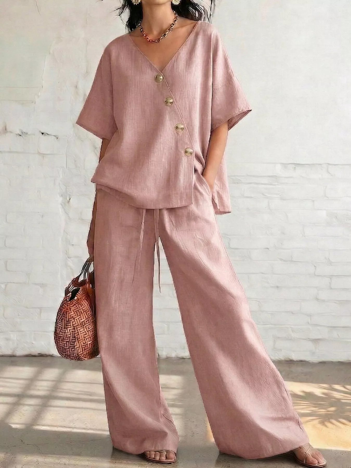 Full Size Surplice Half Sleeve Top and Wide-Leg Pants Set Plus Size designed for comfort and style at Lookzlike