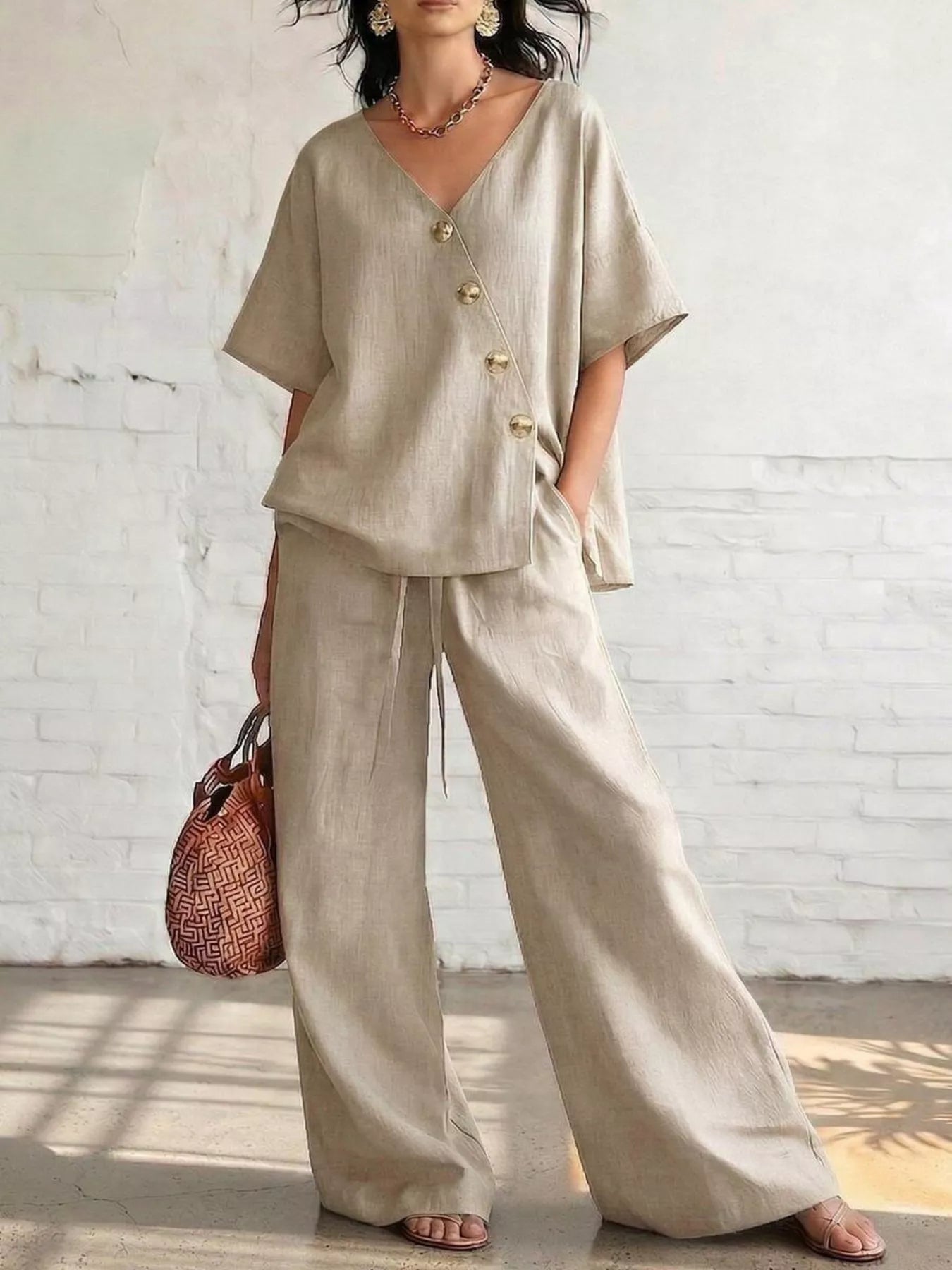 Full Size Surplice Half Sleeve Top and Wide-Leg Pants Set Plus Size designed for comfort and style at Lookzlike