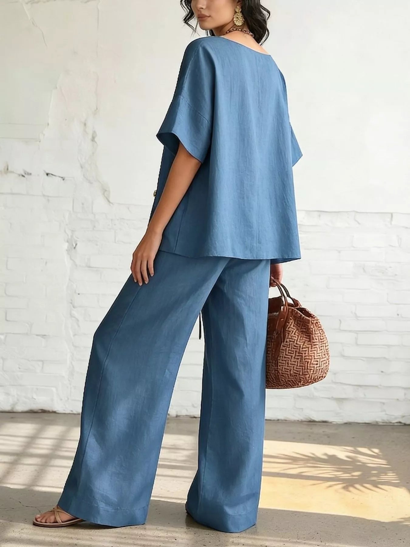 Full Size Surplice Half Sleeve Top and Wide-Leg Pants Set Plus Size designed for comfort and style at Lookzlike