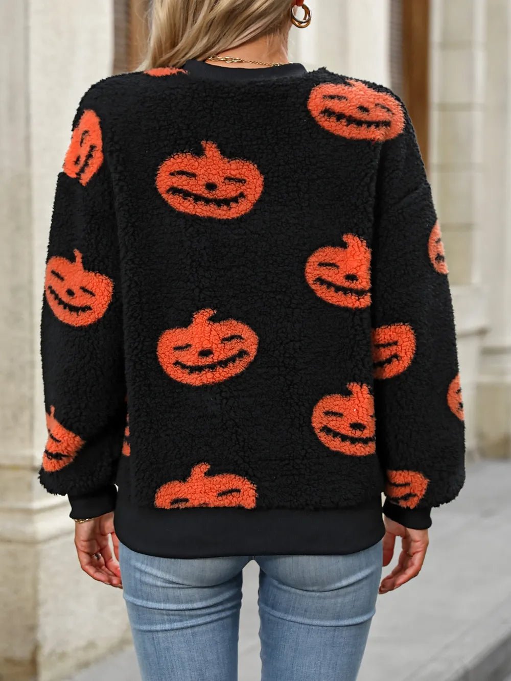 Fuzzy Pumpkin Round Neck Dropped Shoulder Sweater designed for comfort and style at Lookzlike