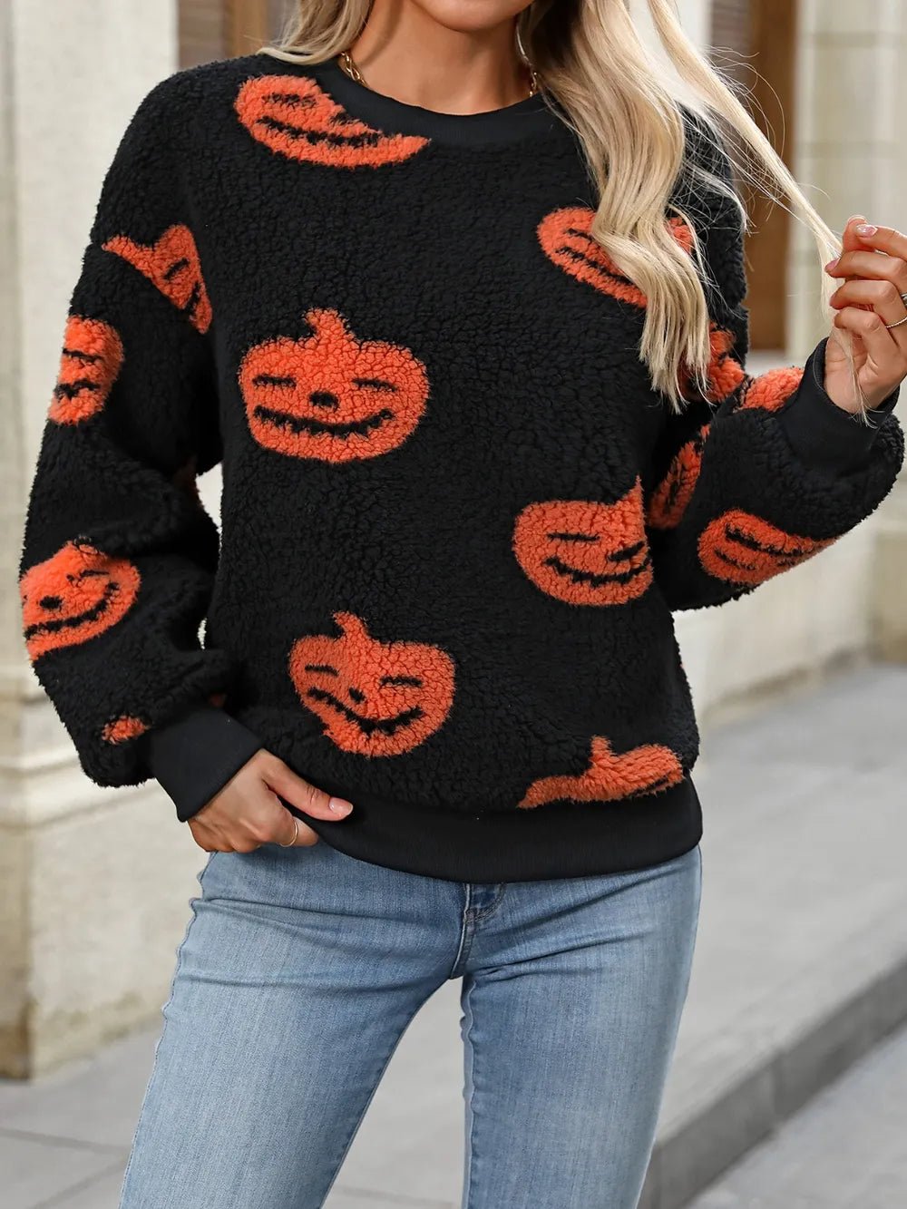 Fuzzy Pumpkin Round Neck Dropped Shoulder Sweater designed for comfort and style at Lookzlike