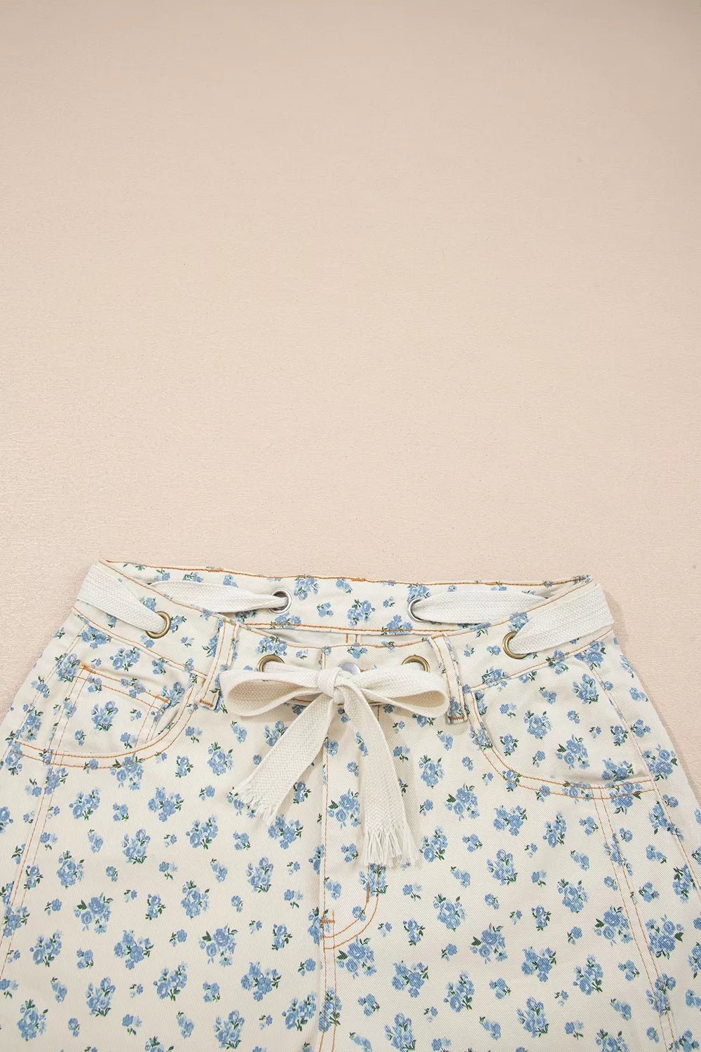 Grommet Knot Waist Floral Barrel Leg Jeans designed for comfort and style at Lookzlike