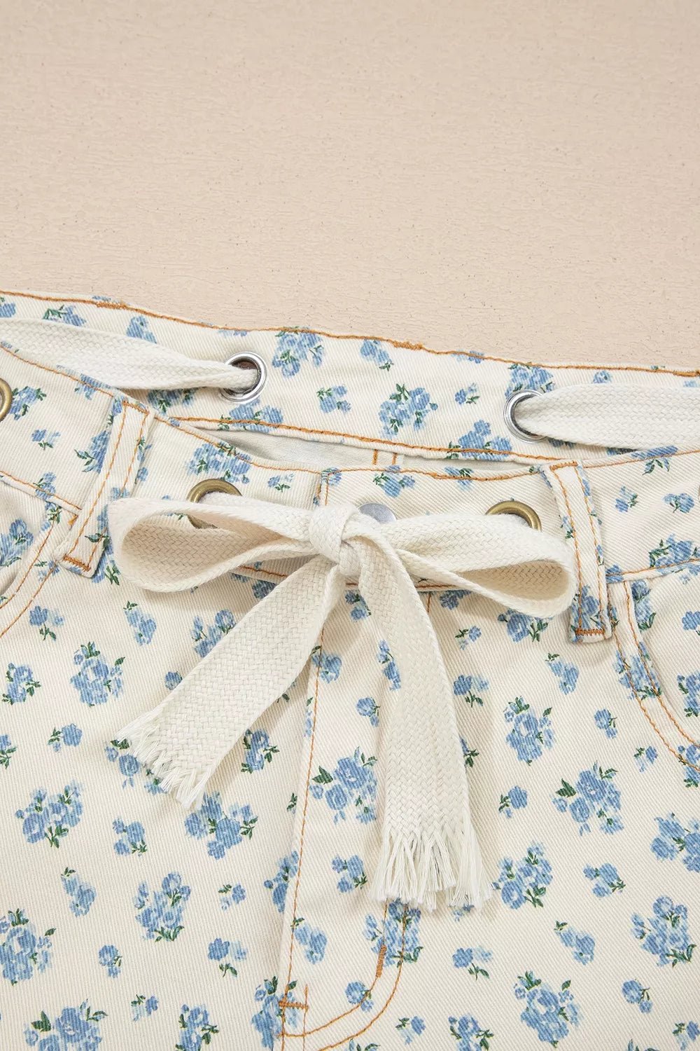Grommet Knot Waist Floral Barrel Leg Jeans designed for comfort and style at Lookzlike