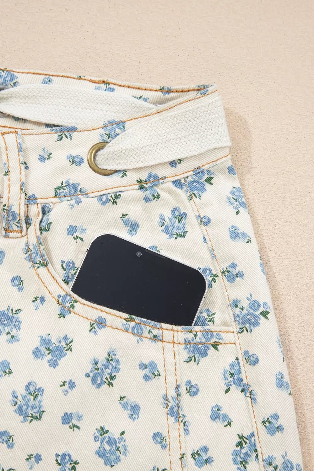 Grommet Knot Waist Floral Barrel Leg Jeans designed for comfort and style at Lookzlike