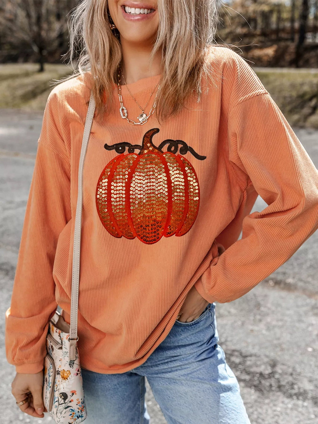 Halloween Sequined Pumpkin Ribbed Round Neck Sweatshirt designed for comfort and style at Lookzlike