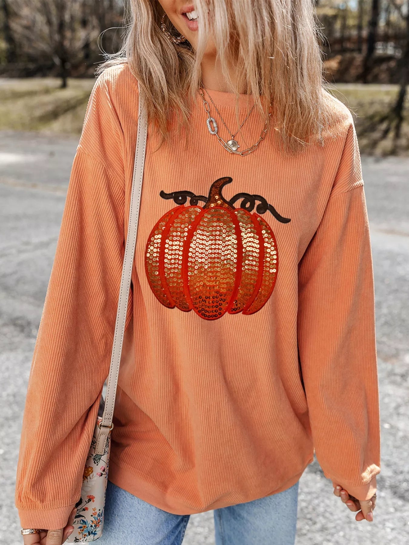 Halloween Sequined Pumpkin Ribbed Round Neck Sweatshirt designed for comfort and style at Lookzlike