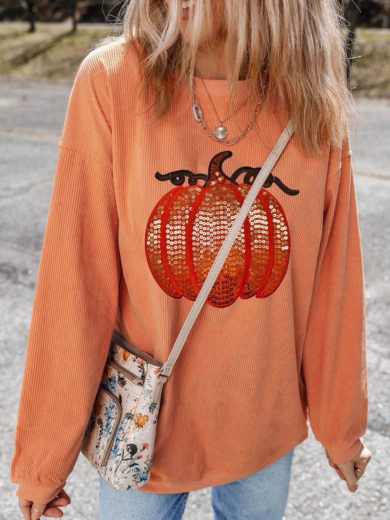 Halloween Sequined Pumpkin Ribbed Round Neck Sweatshirt designed for comfort and style at Lookzlike