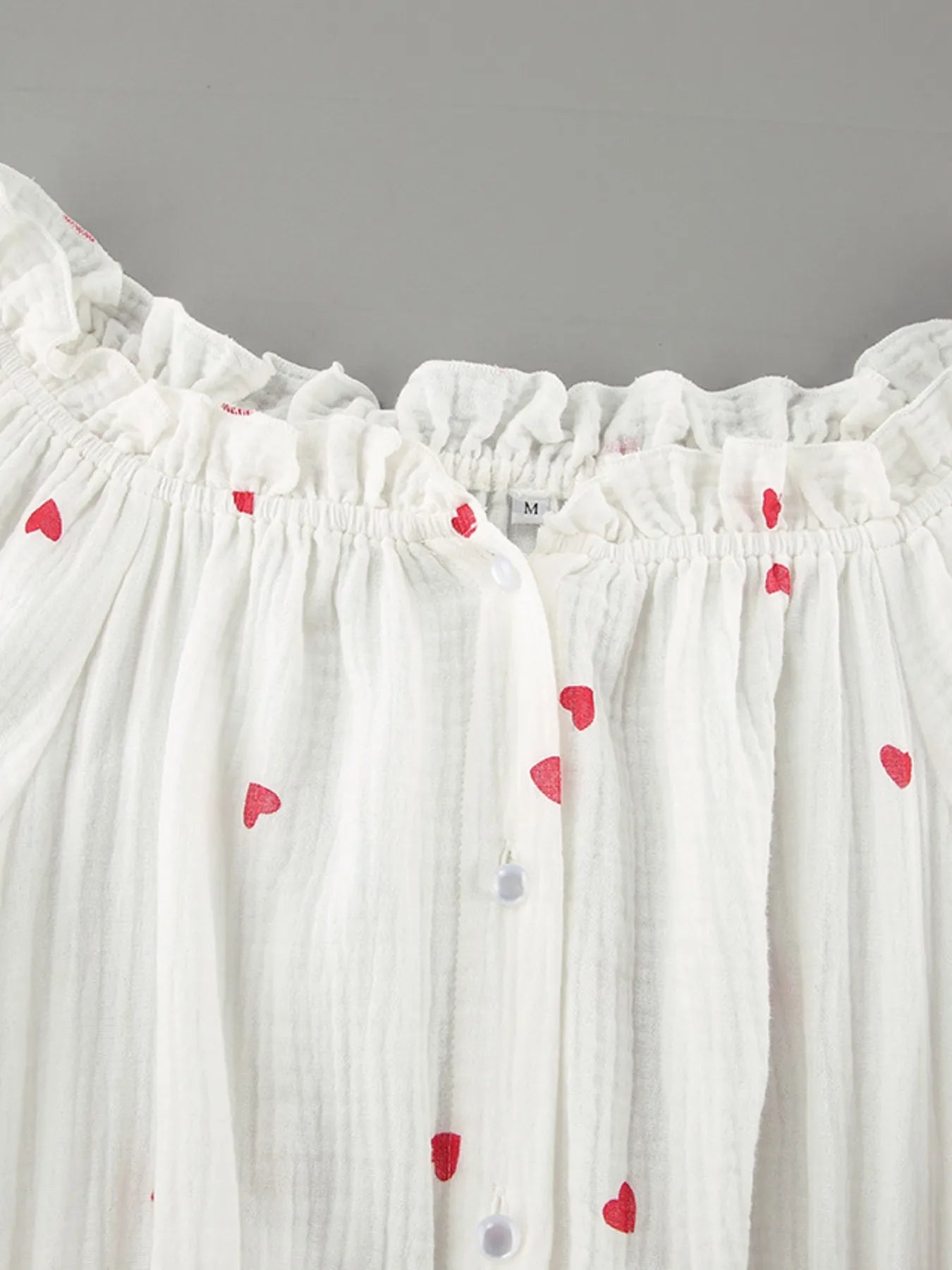 Heart Printed Off-Shoulder Ruffle Mini Dress designed for comfort and style at Lookzlike