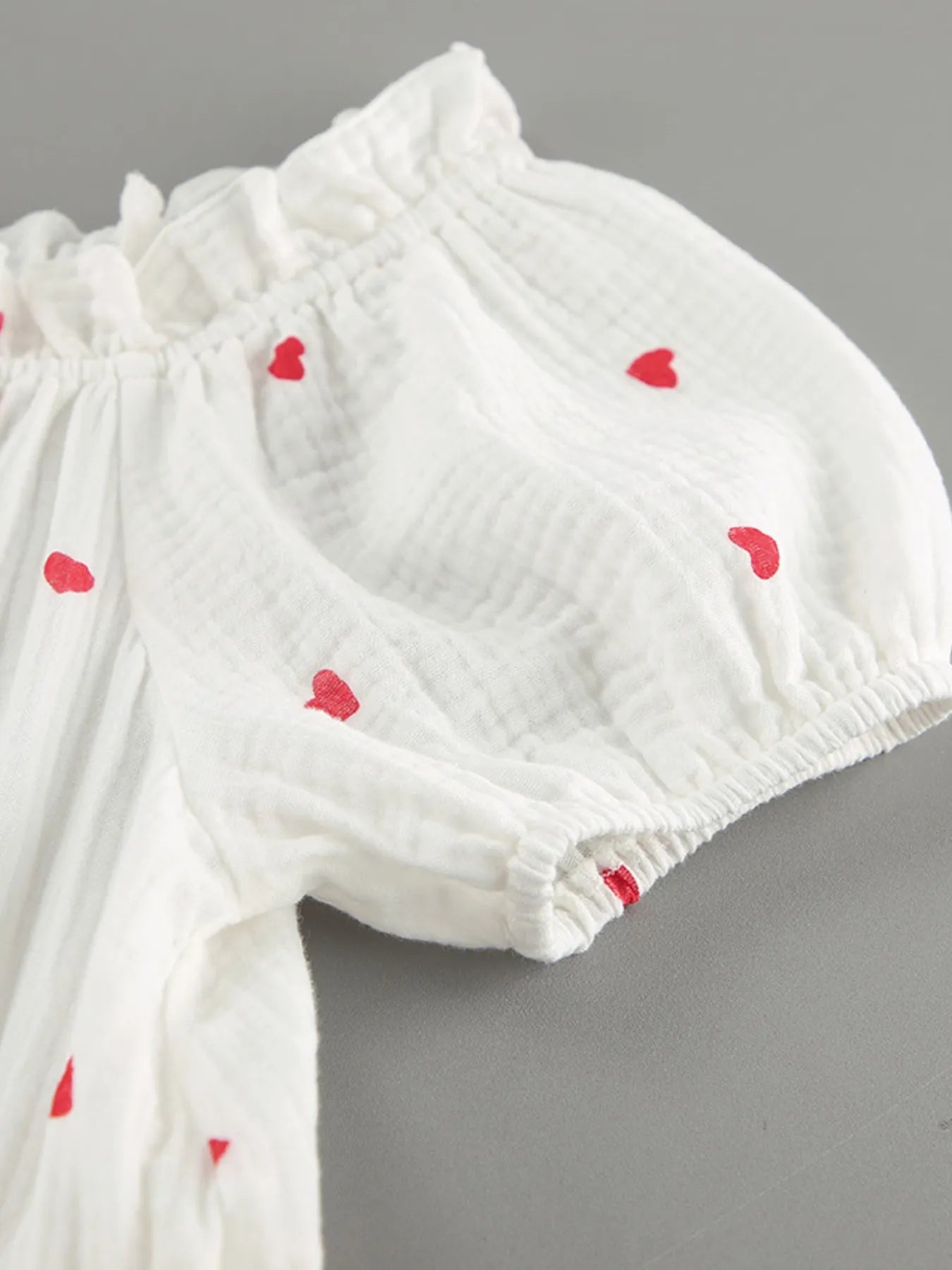 Heart Printed Off-Shoulder Ruffle Mini Dress designed for comfort and style at Lookzlike