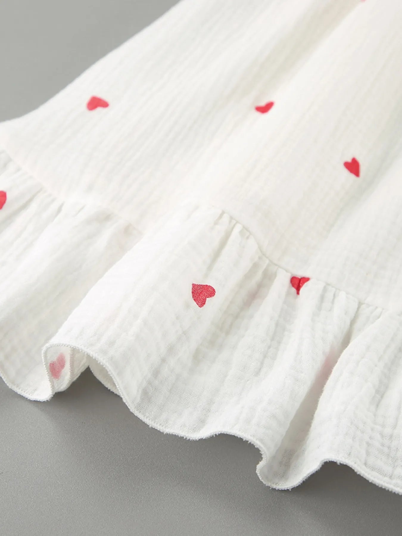 Heart Printed Off-Shoulder Ruffle Mini Dress designed for comfort and style at Lookzlike