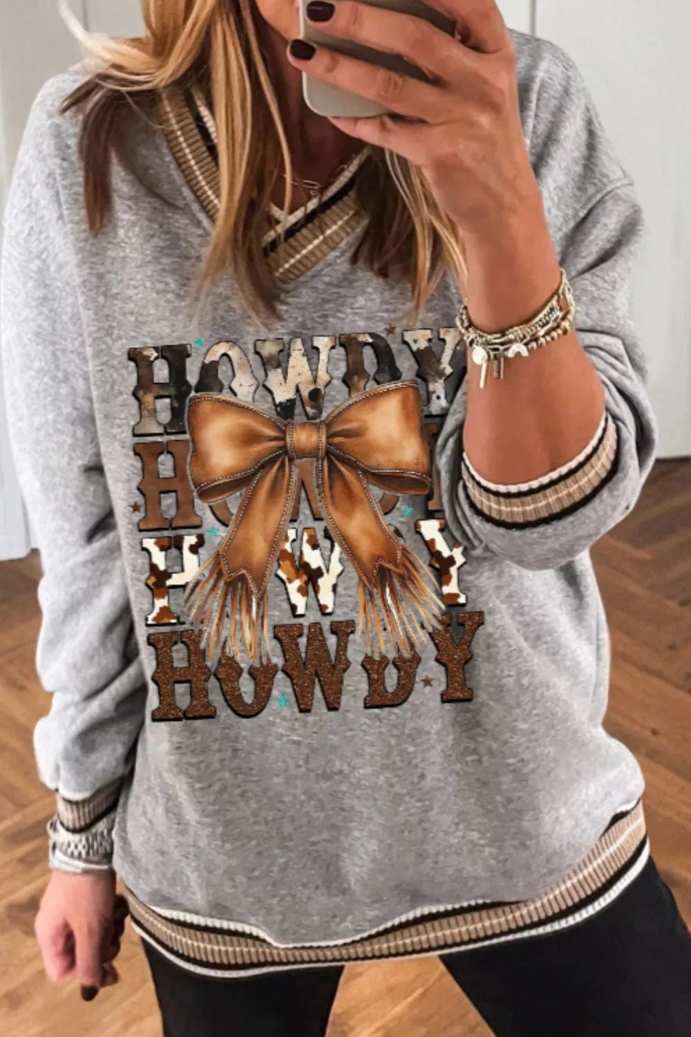 Howdy Graphic V - Neck Sweatshirt designed for comfort and style at Lookzlike