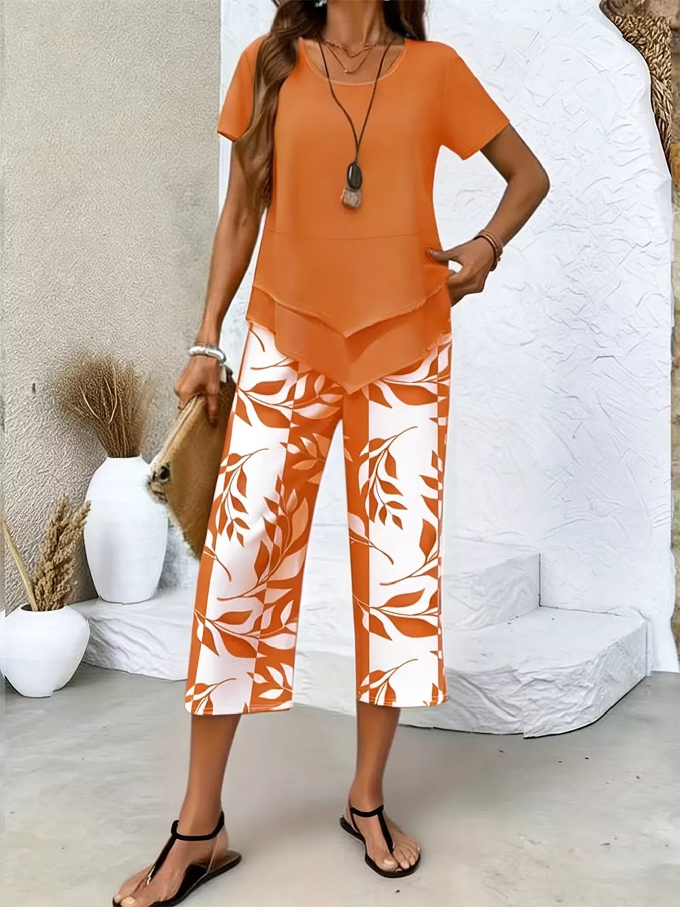 Layered Top and Leaf Print Cropped Pants Set designed for comfort and style at Lookzlike