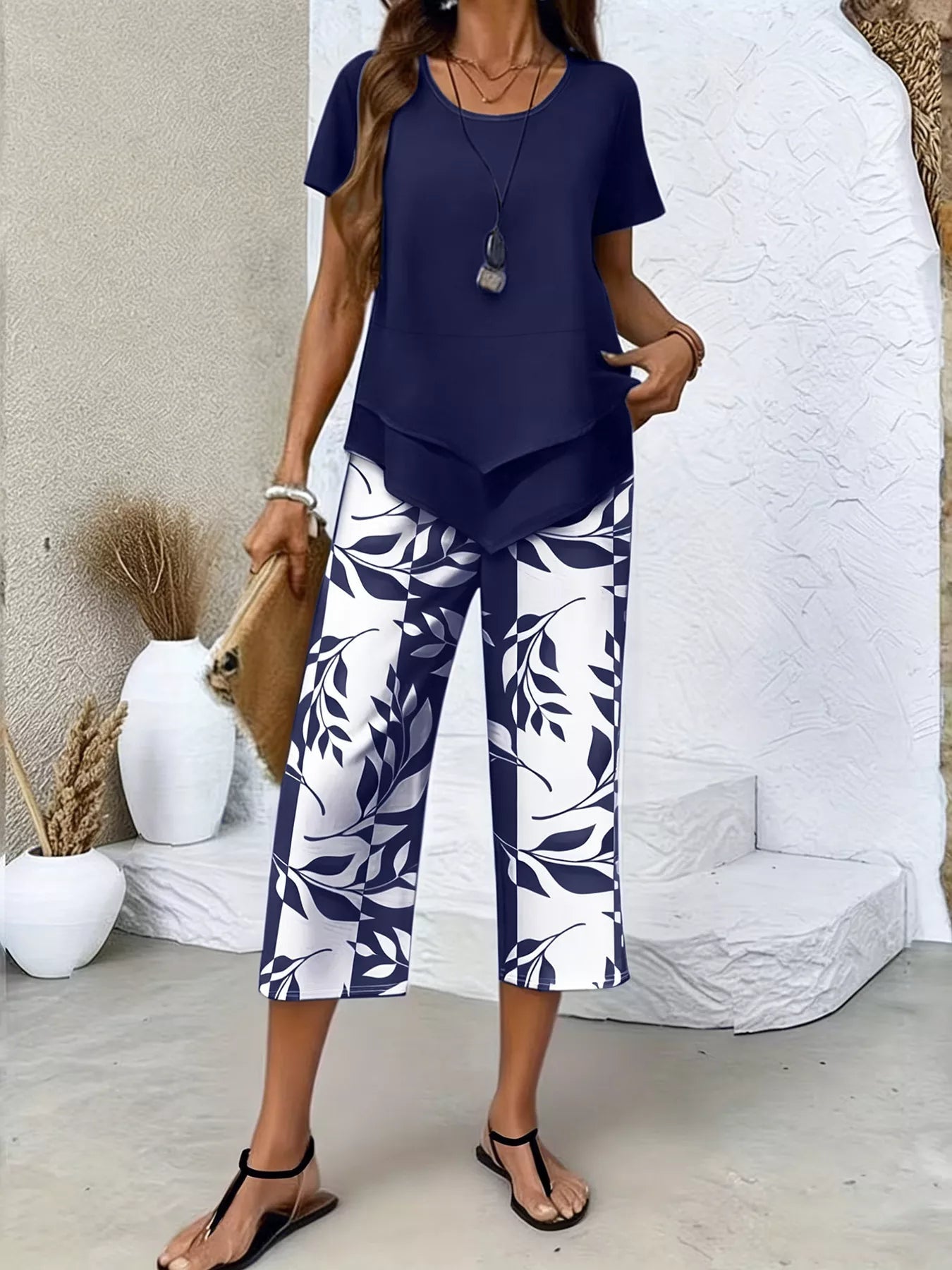 Layered Top and Leaf Print Cropped Pants Set designed for comfort and style at Lookzlike