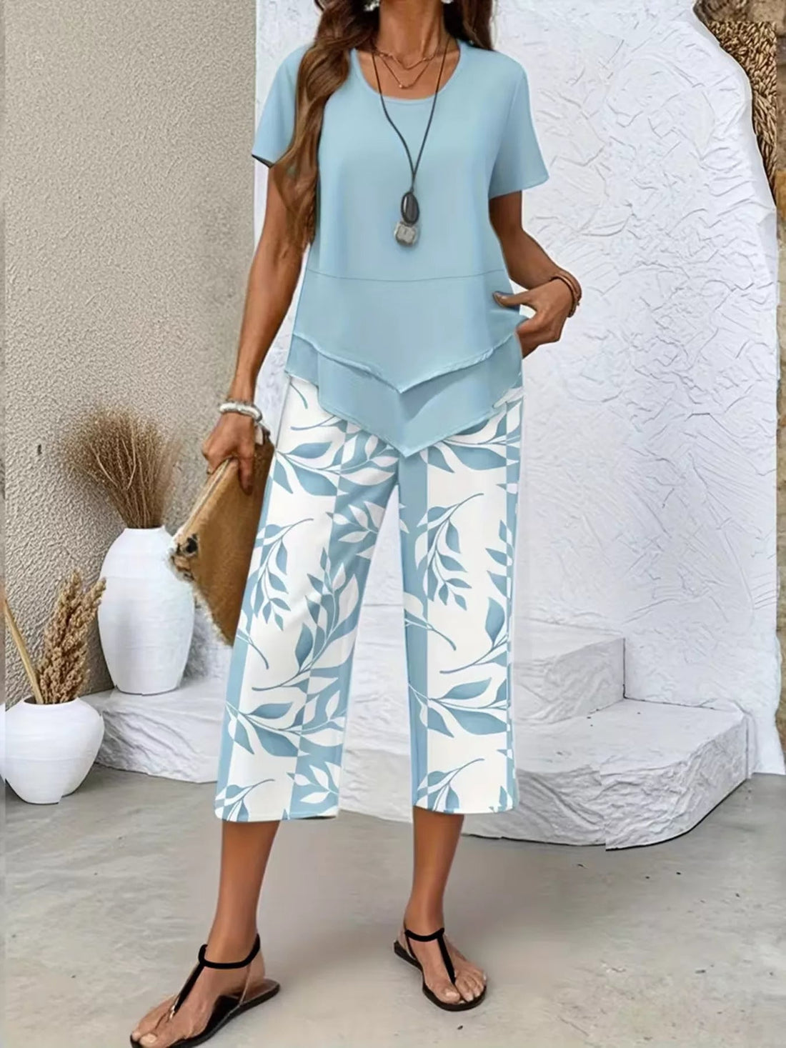 Layered Top and Leaf Print Cropped Pants Set designed for comfort and style at Lookzlike