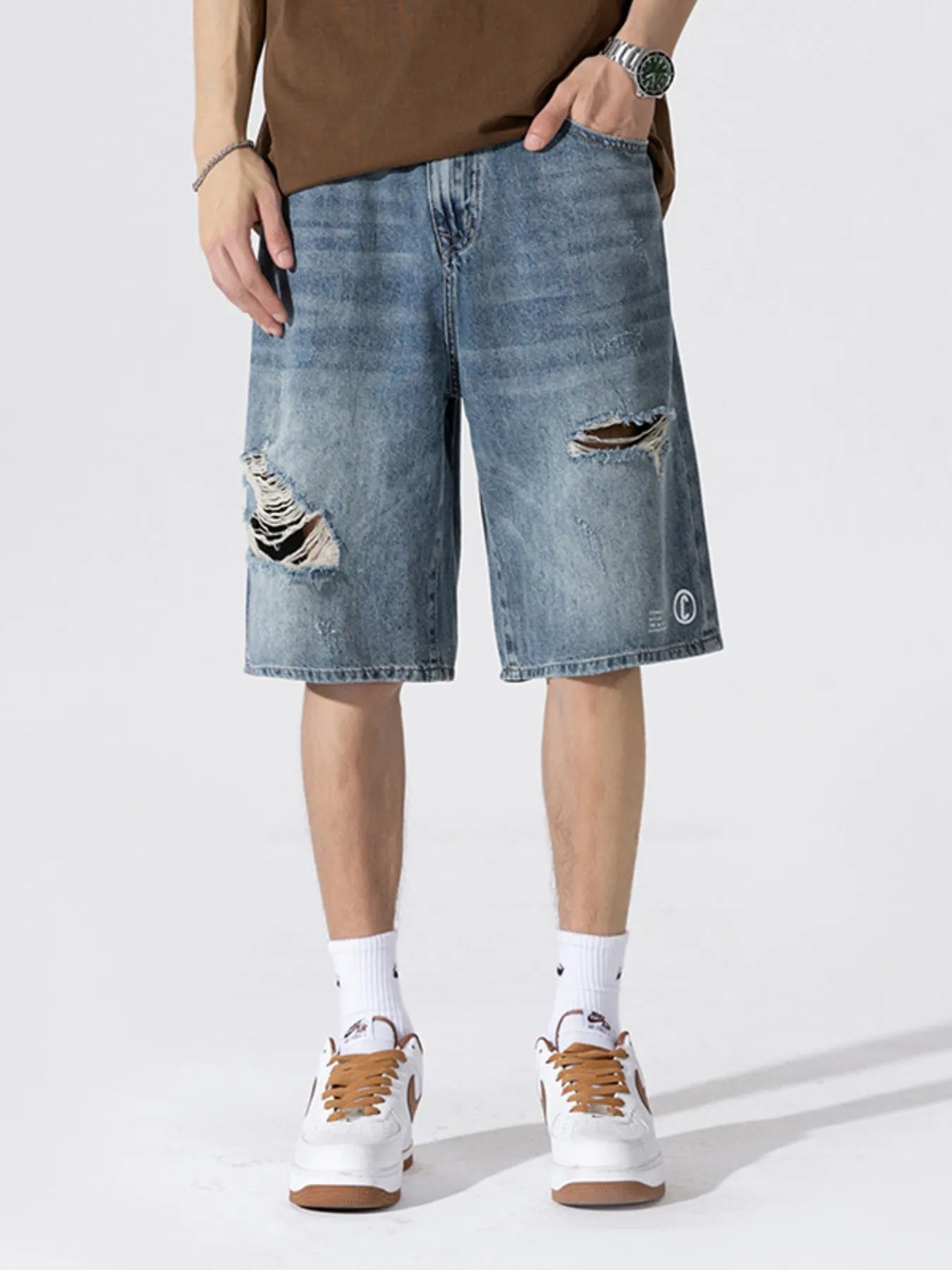 Men's Distressed Loose Fit Denim Shorts designed for comfort and style at Lookzlike