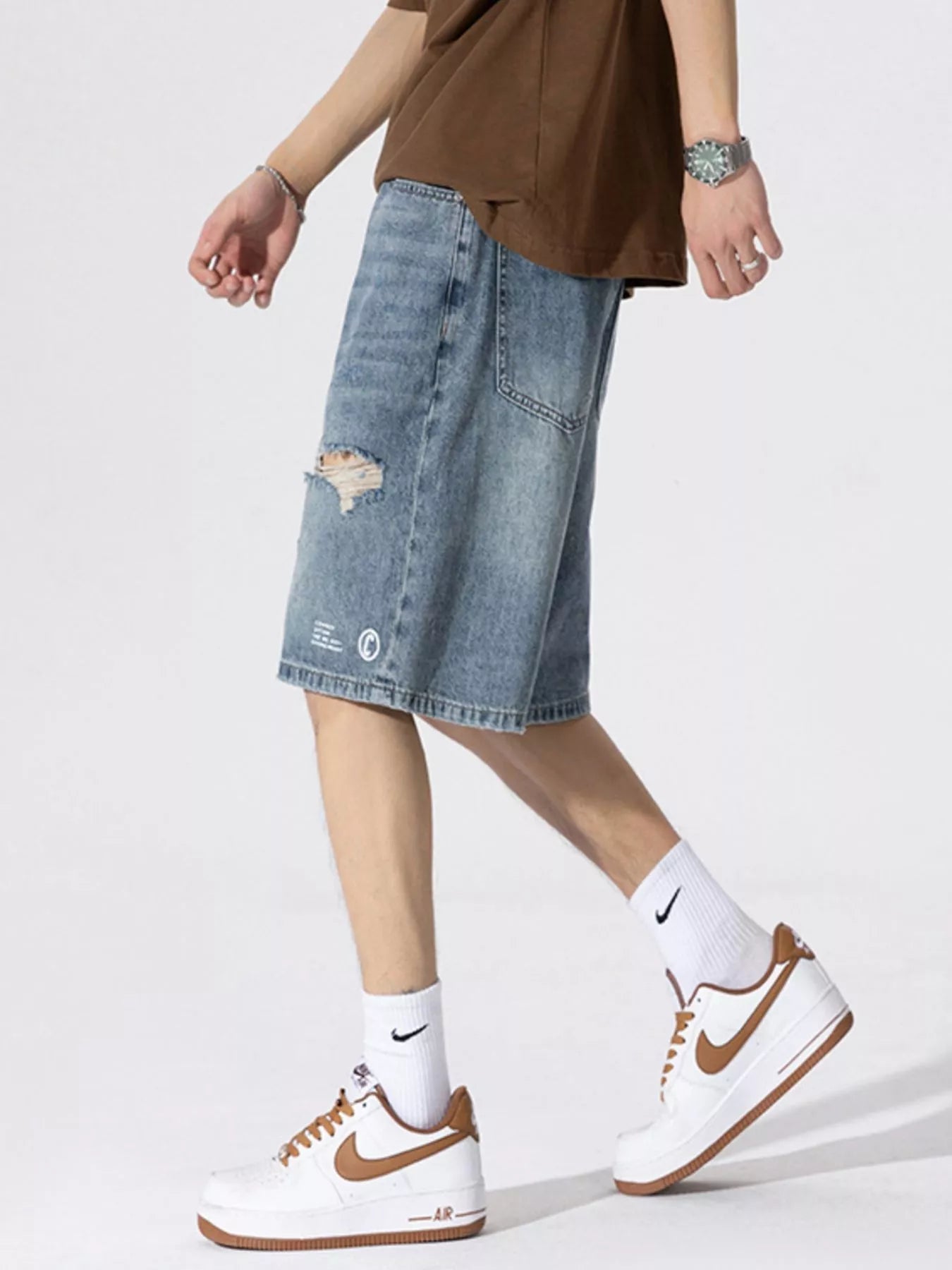 Men's Distressed Loose Fit Denim Shorts designed for comfort and style at Lookzlike