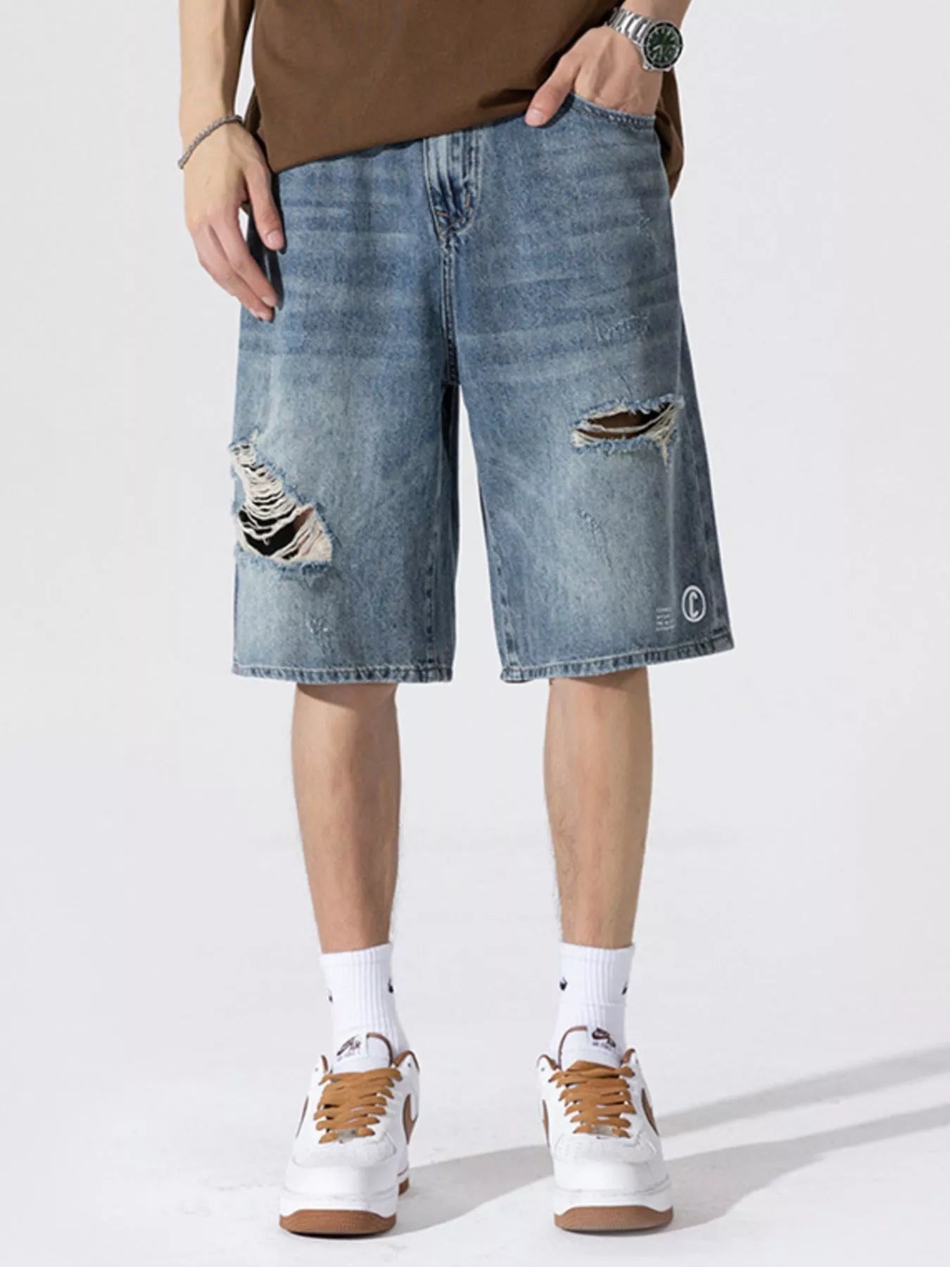 Men's Distressed Loose Fit Denim Shorts designed for comfort and style at Lookzlike