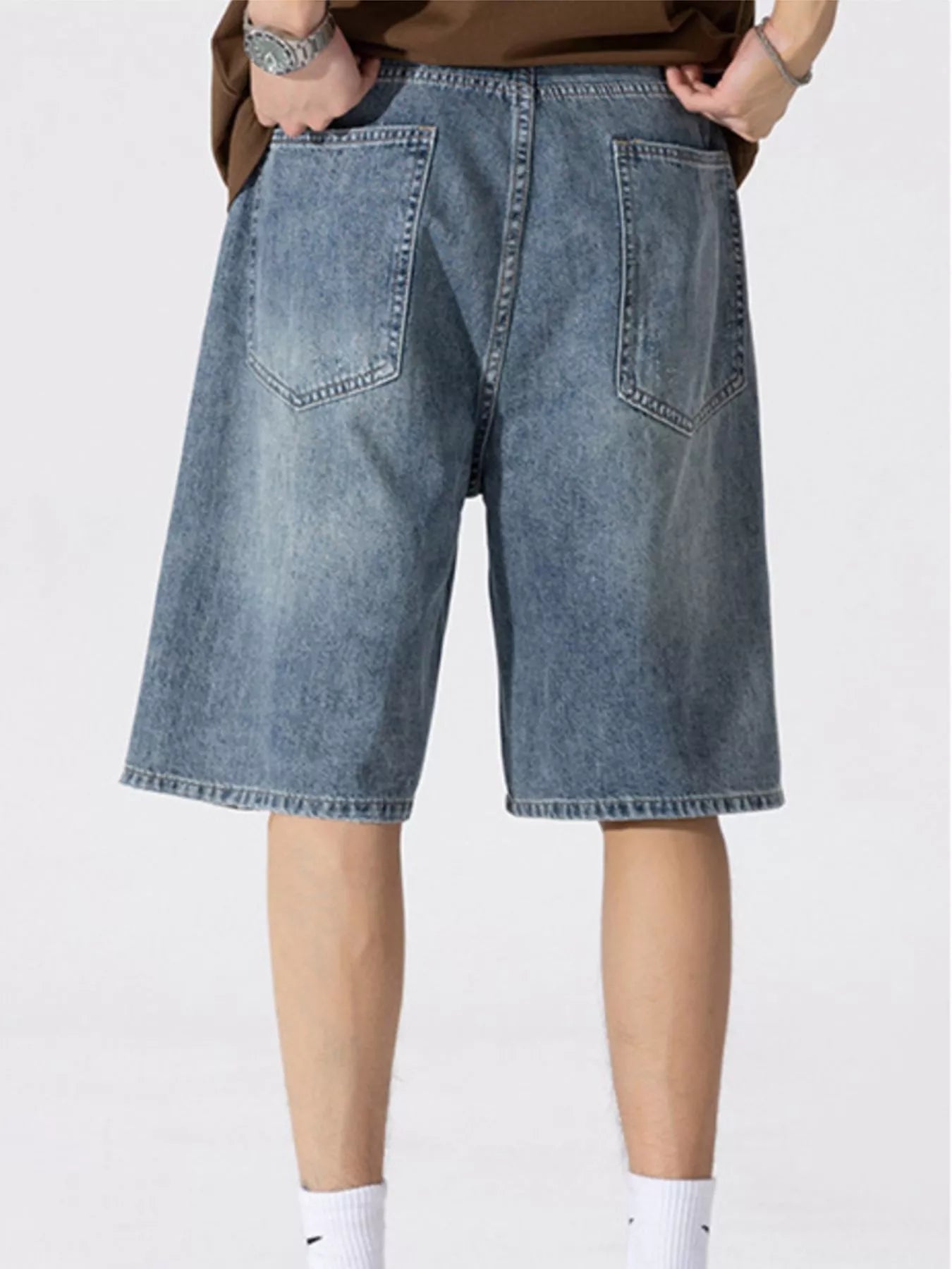 Men's Distressed Loose Fit Denim Shorts designed for comfort and style at Lookzlike